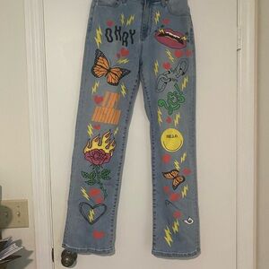 Akira High Waisted Graphic Blue Jeans with Colorful Prints